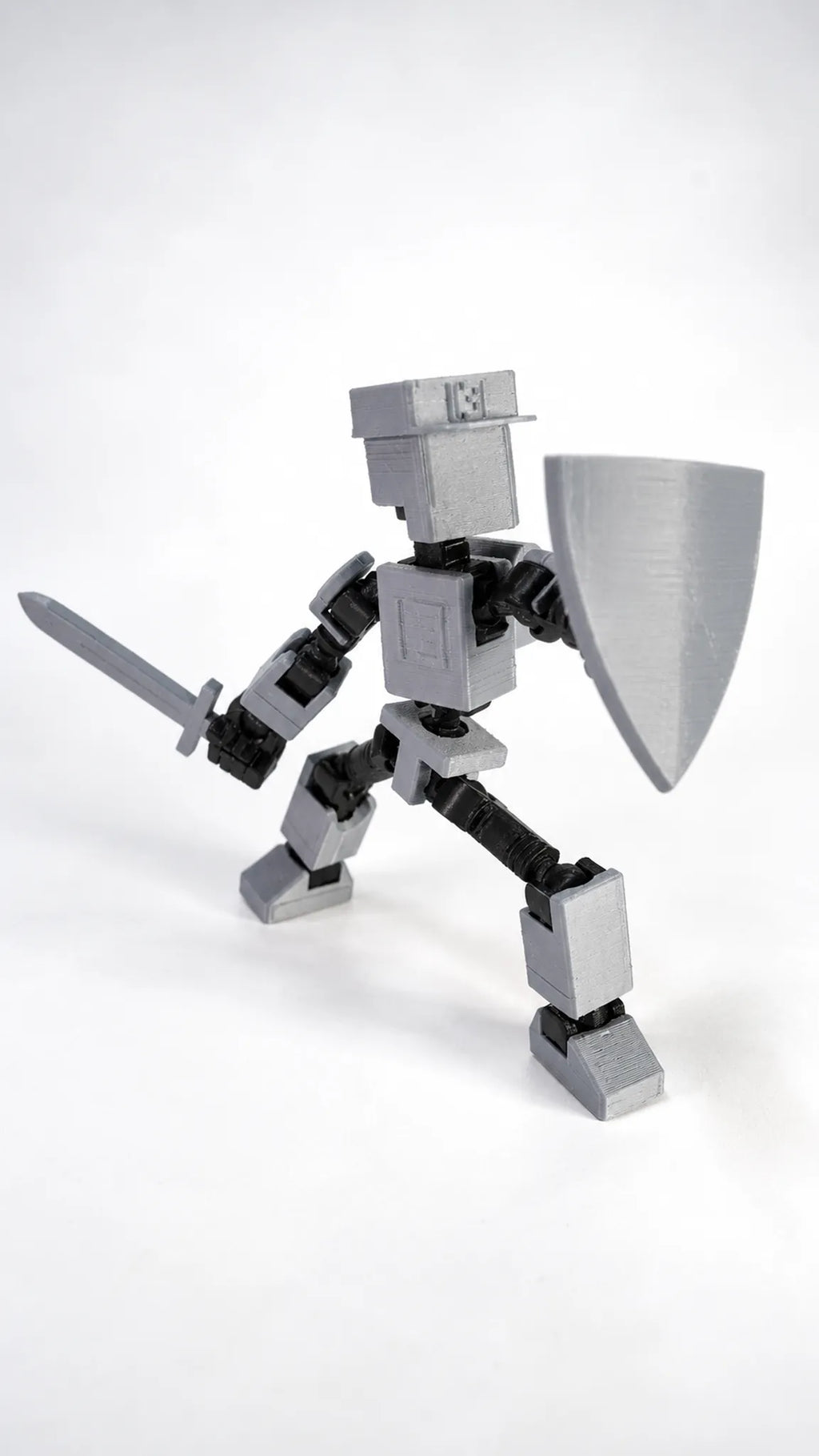 Mini T13 gris figura articulada en pose de acción