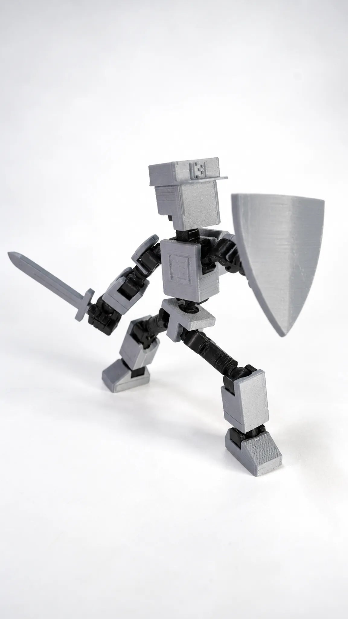 Mini T13 gris figura articulada en pose de acción
